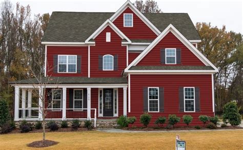 red vinyl siding house with black metal roof|red vinyl home ideas.